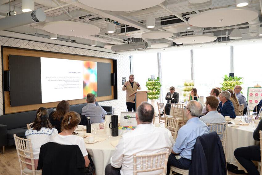 Antony Slumbers presenting at the front of an Estate Optimisation event at Mitie offices in the Shard, London,